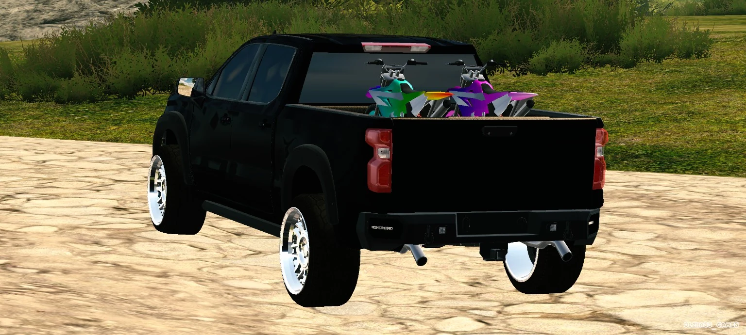Black custom pickup truck rear view with bikes in the bed